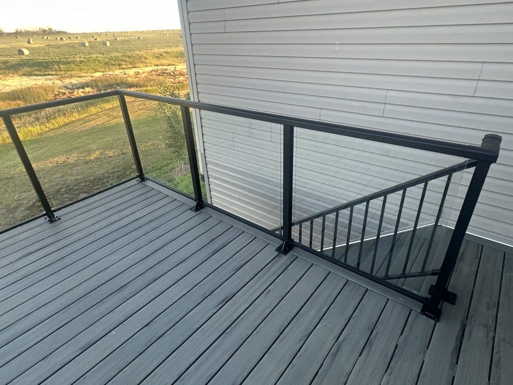 composite deck with glass railing and landscape view in Strathmore Alberta
