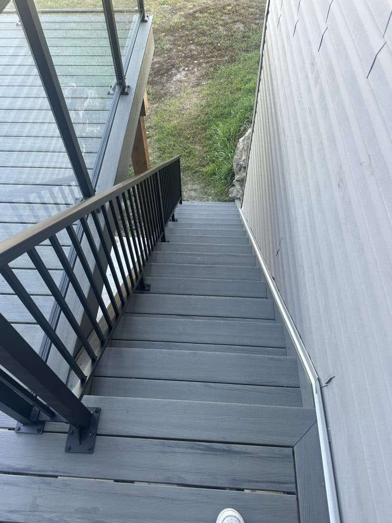 composite deck stairs with black aluminum railing in Strathmore Alberta