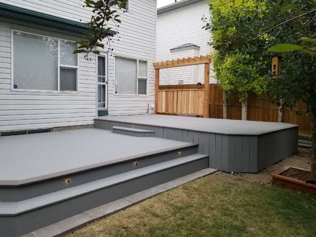 Raised backyard deck built in Calgary by Pemadale